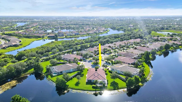 an aerial view of residential house with outdoor space and swimming pool
