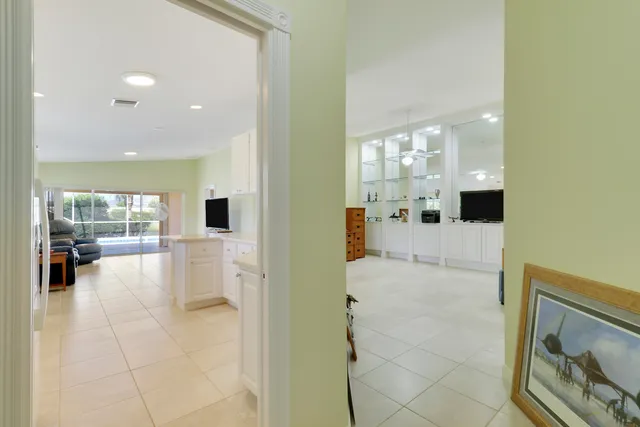 a view of a bathroom with a tub shower and mirror