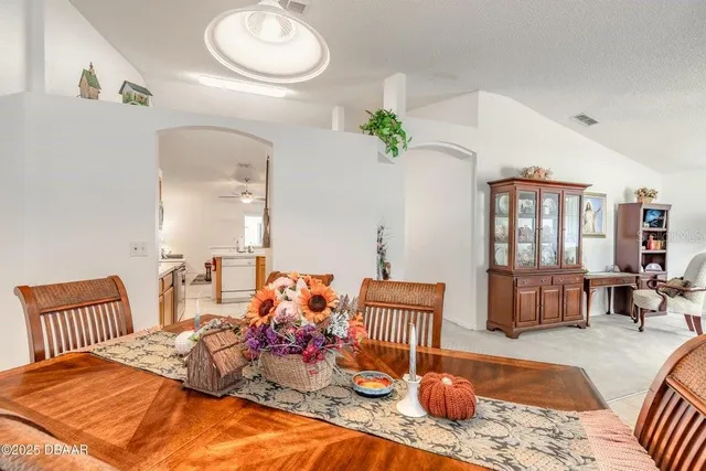 a bedroom with bed and wooden floor