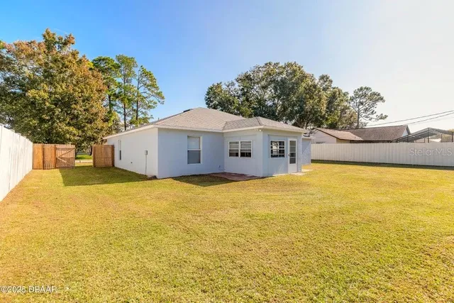 a house view with a swimming pool