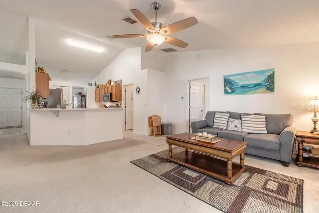 a living room with furniture and a table