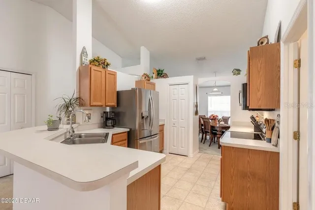 a view of living room with furniture and large window