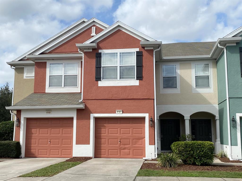 4161 Southwest 43rd Circle Ocala, FL 34474 - Photo 1 of 1 a front view of a house with garden