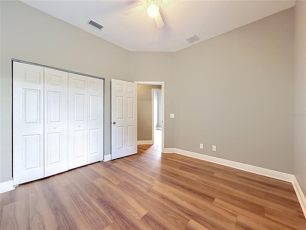 28549 Shirley Shores Road Tavares, FL 32778 - Photo 35 of 65 a view of an empty room with wooden floor