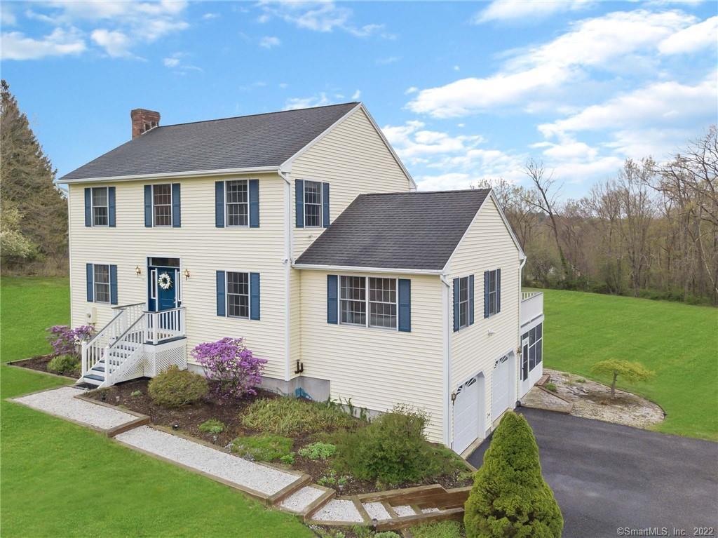 20 Brinsmade Road Washington, CT 06794 - Photo 1 of 1 a front view of a house with garden