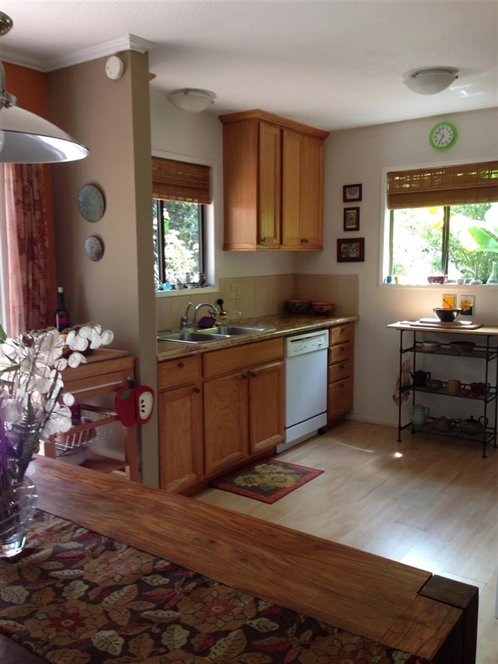 339 Ainakula Road Kula, HI 96790 - Photo 4 of 20 a kitchen with a sink and a stove top oven