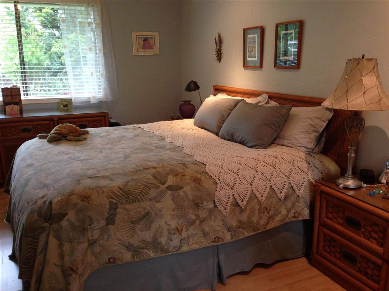 339 Ainakula Road Kula, HI 96790 - Photo 6 of 20 a bed sitting in a bedroom next to a window