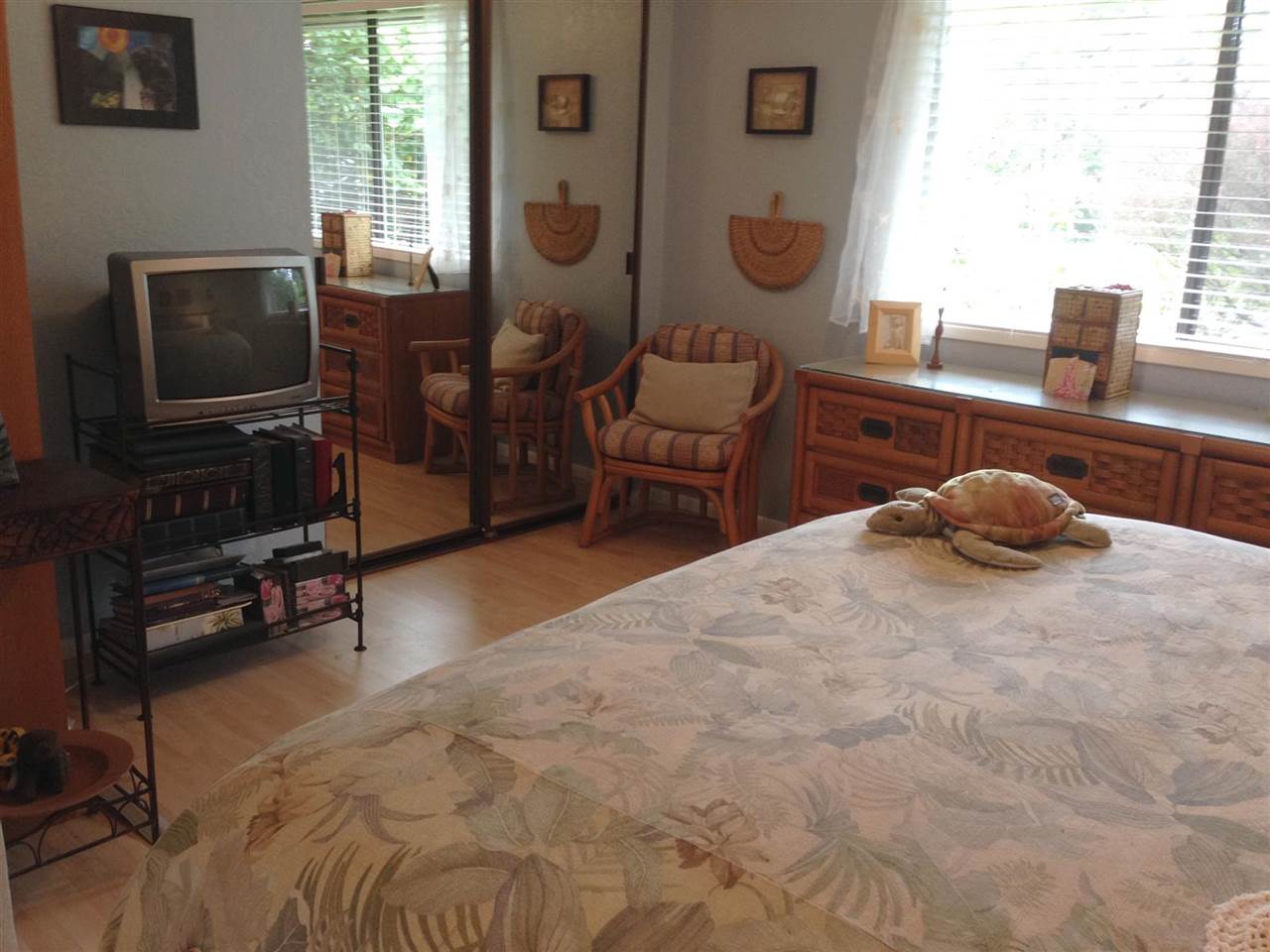 339 Ainakula Road Kula, HI 96790 - Photo 7 of 20 a bedroom with a bed a flat screen tv and windows
