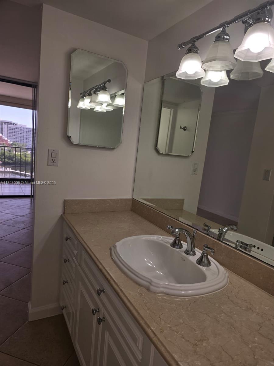Brickell Place Miami, FL 33129 - Photo 7 of 24 a bathroom with a sink and a mirror