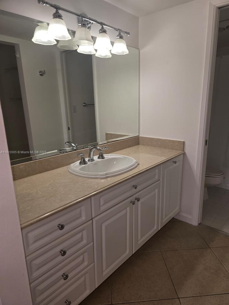 Brickell Place Miami, FL 33129 - Photo 8 of 24 a bathroom with a sink vanity and a mirror