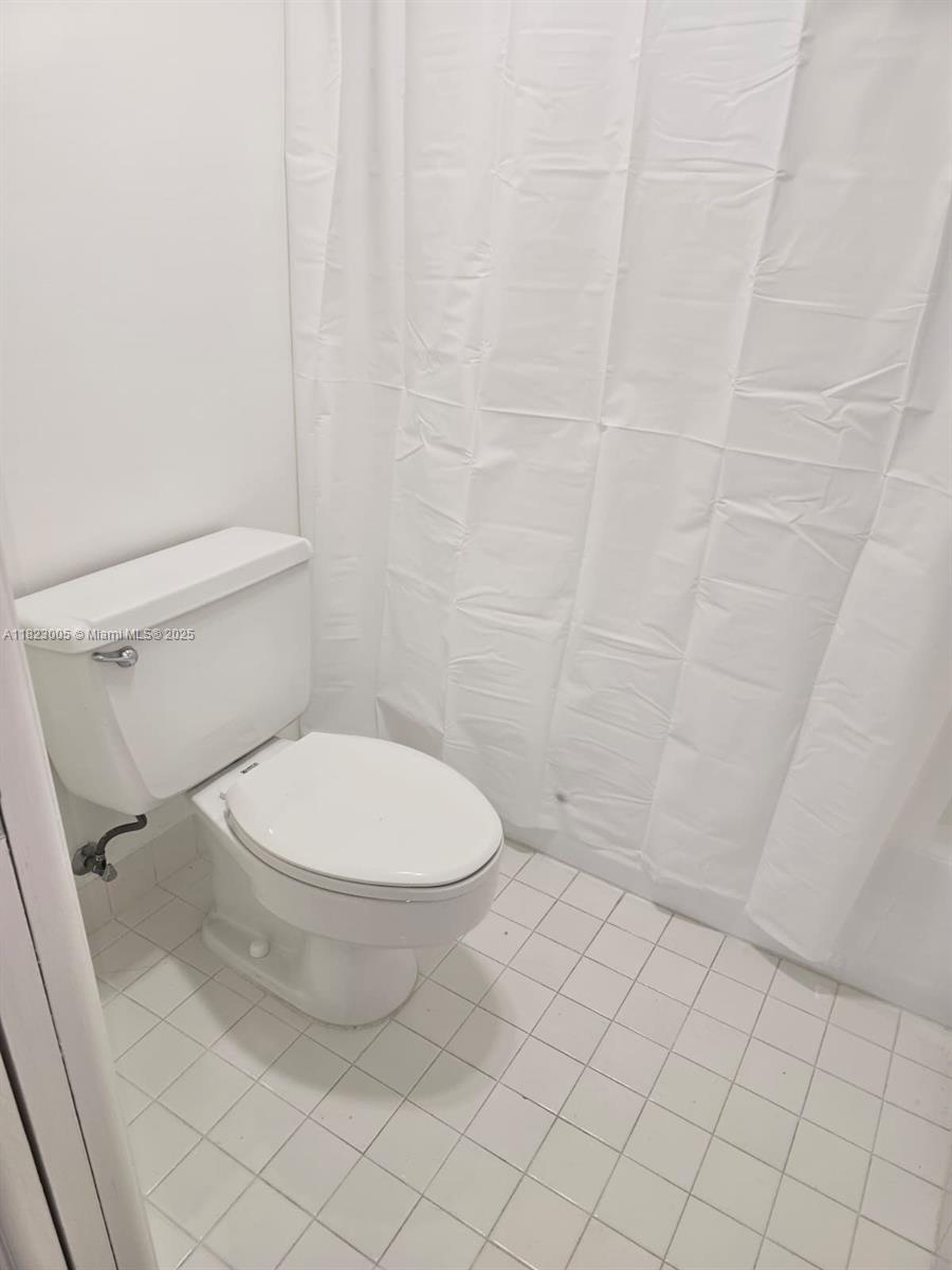 Brickell Place Miami, FL 33129 - Photo 9 of 24 a bathroom with a toilet and a shower