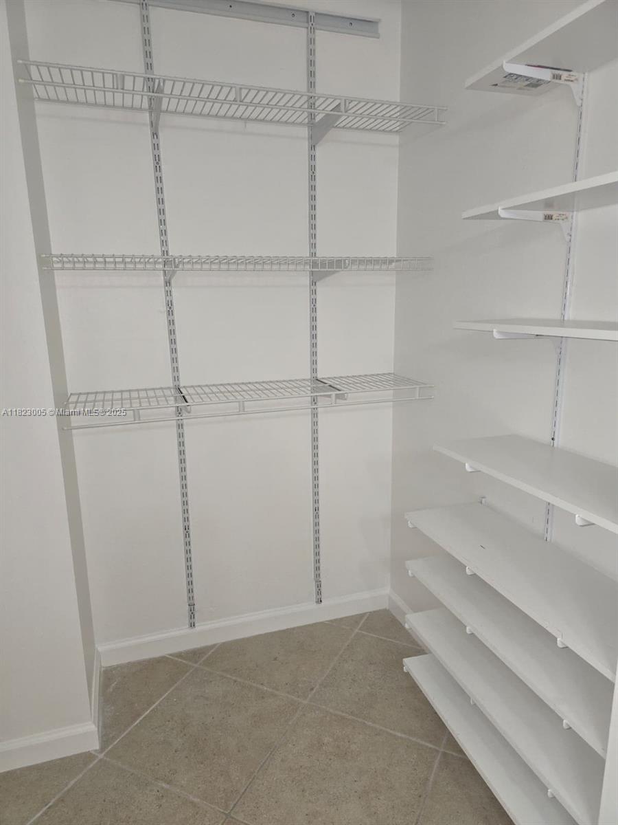 Brickell Place Miami, FL 33129 - Photo 10 of 24 a view of an empty walk in closet