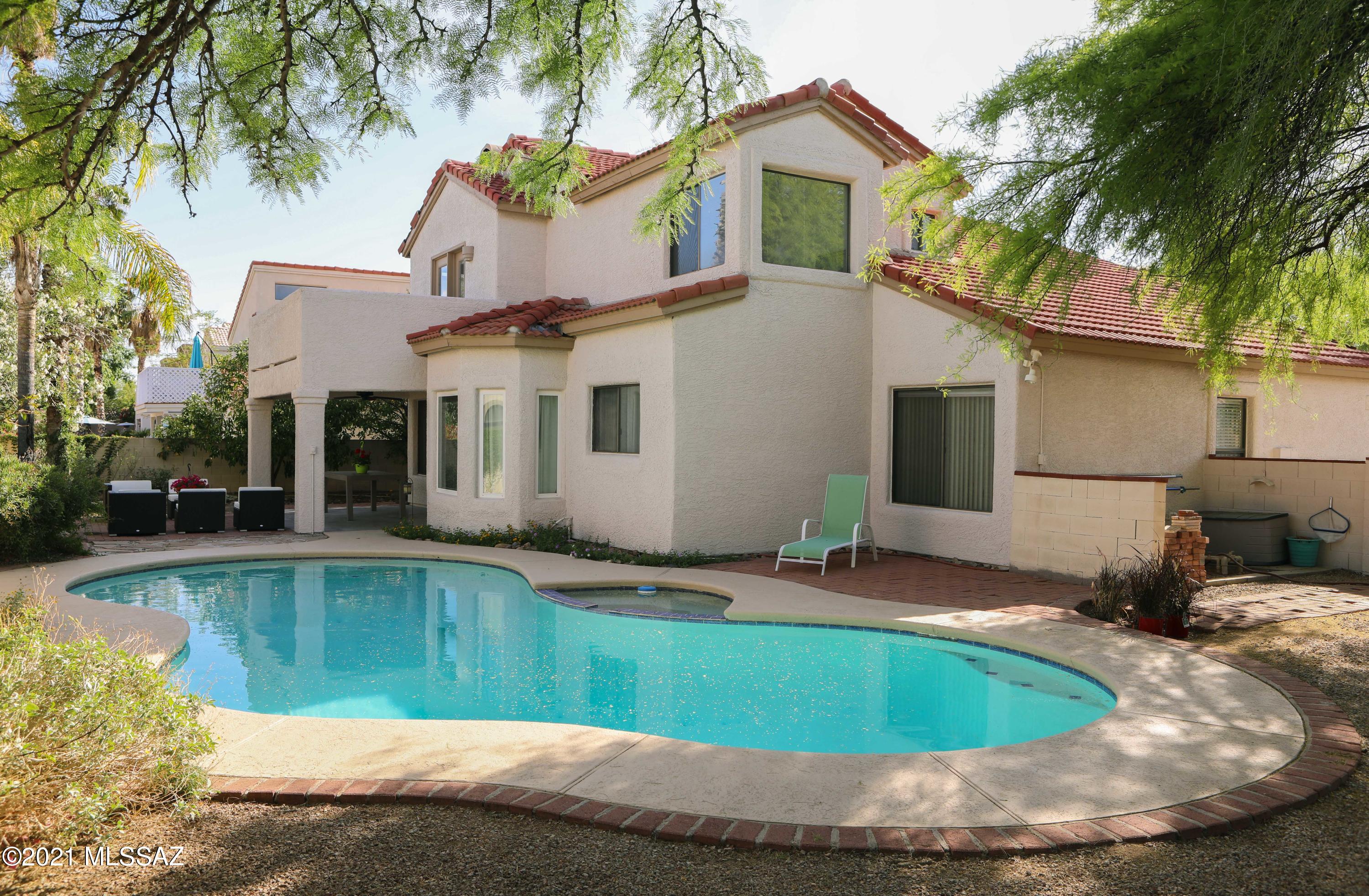 12560 North Wayfarer Way Oro Valley, AZ 85755 - Photo 22 of 43 a view of a house with swimming pool