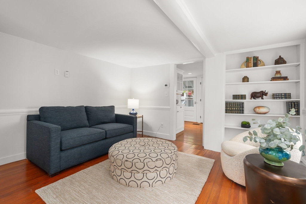 165 Highland Street, Unit 165 Dedham, MA 02026 - Photo 13 of 40 a living room with furniture and flowers