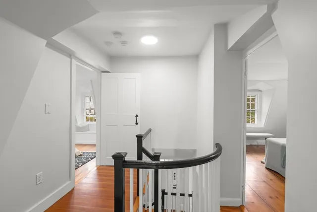 a view of a hallway with a hardwood floor