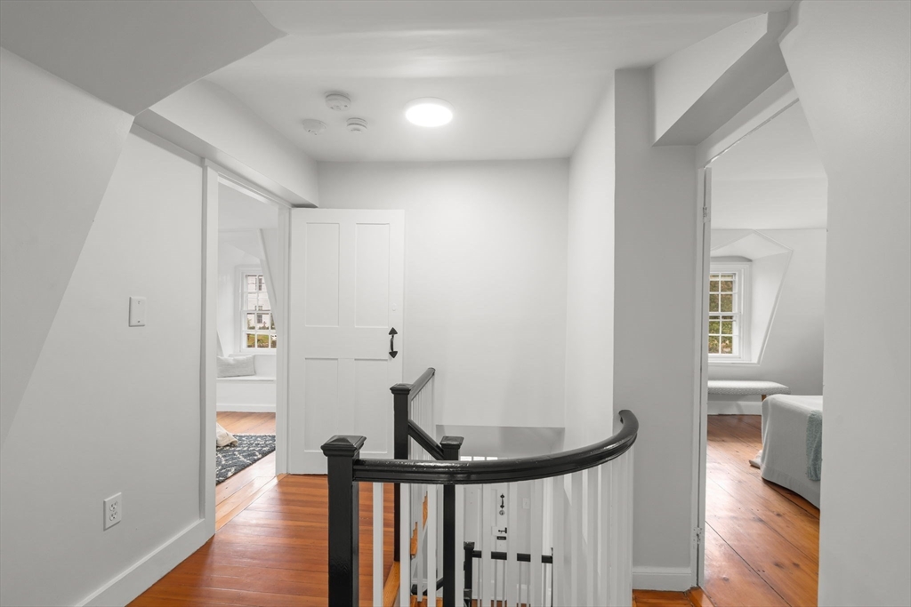 165 Highland Street, Unit 165 Dedham, MA 02026 - Photo 23 of 40 a view of a hallway with a hardwood floor