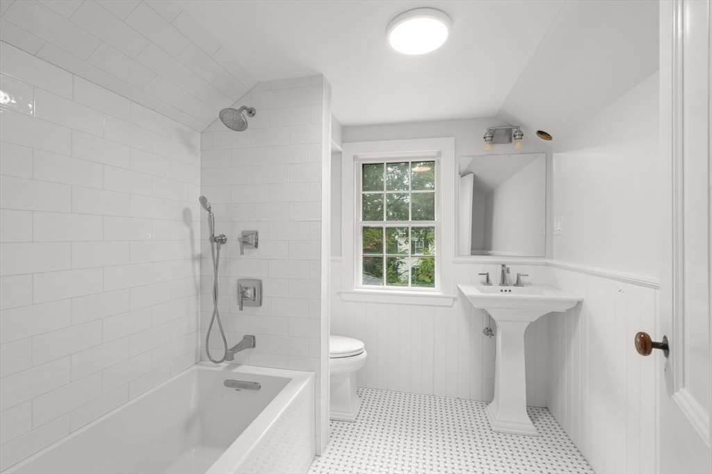 165 Highland Street, Unit 165 Dedham, MA 02026 - Photo 29 of 40 a bathroom with a sink toilet and shower