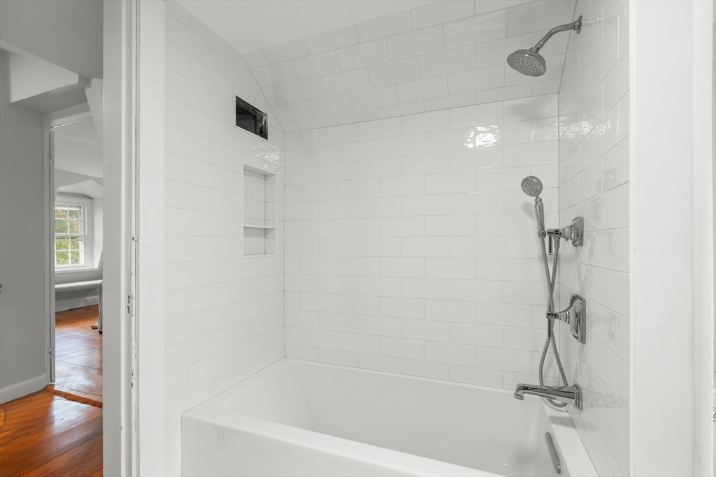 165 Highland Street, Unit 165 Dedham, MA 02026 - Photo 30 of 40 a bathroom with a shower