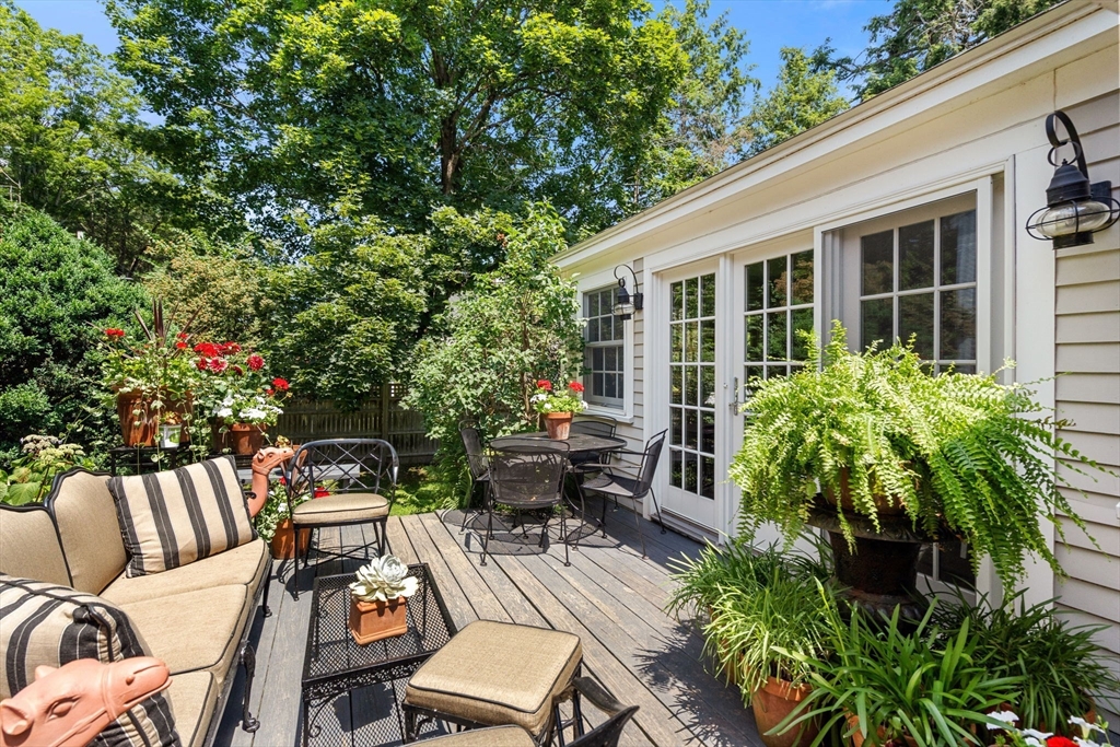 165 Highland Street, Unit 165 Dedham, MA 02026 - Photo 32 of 40 a view of a patio with chairs and potted plants