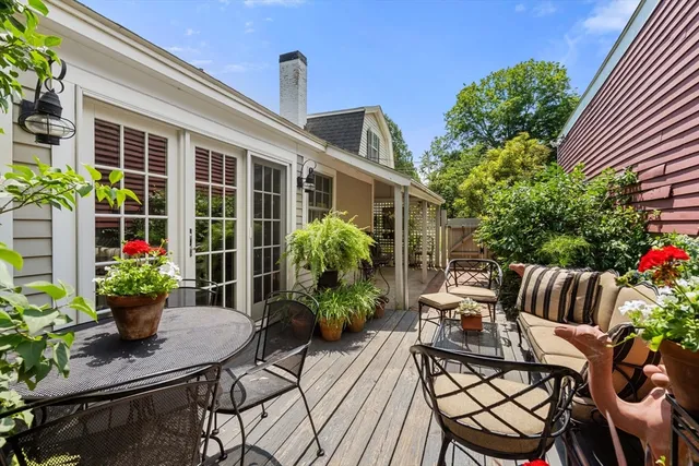 a view of backyard with sitting area