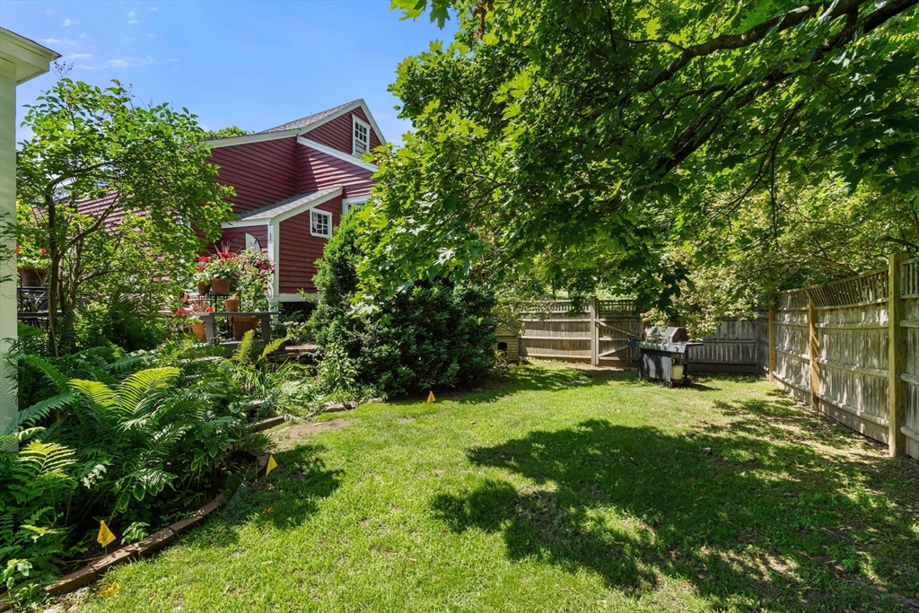 165 Highland Street, Unit 165 Dedham, MA 02026 - Photo 35 of 40 a backyard of a house with lots of green space