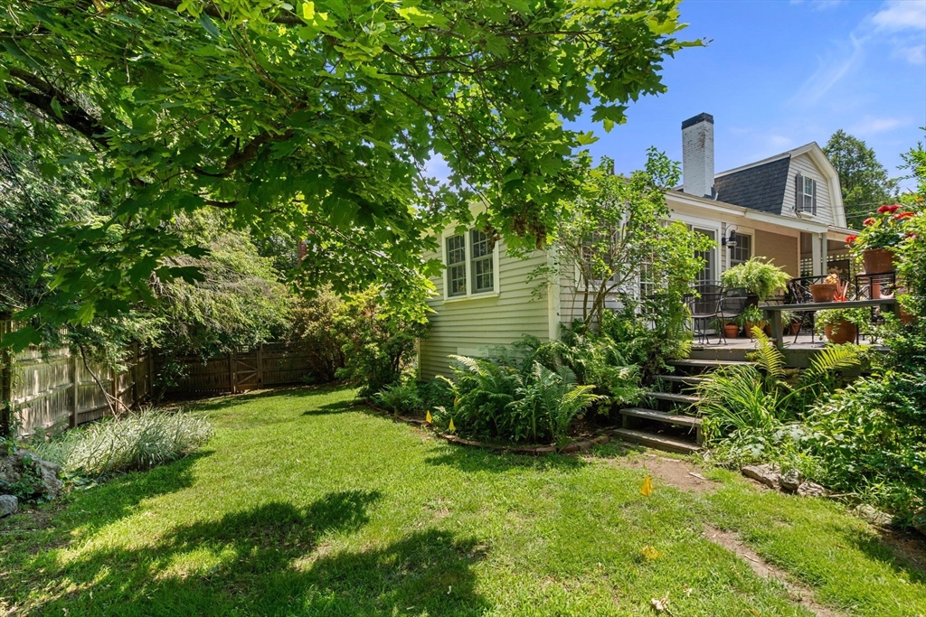 165 Highland Street, Unit 165 Dedham, MA 02026 - Photo 36 of 40 a view of a garden with plants