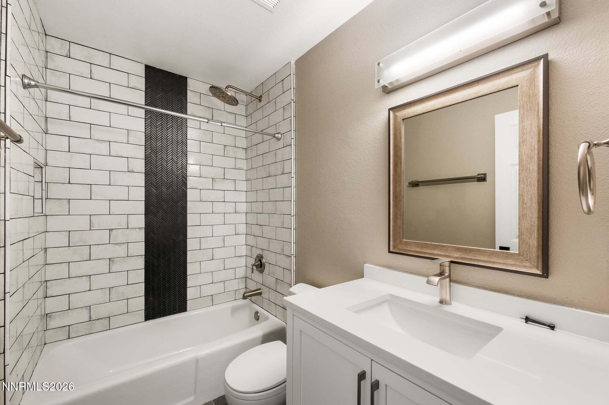 430 Angela Place Reno, NV 89509 - Photo 32 of 48 a bathroom with a sink a toilet and shower