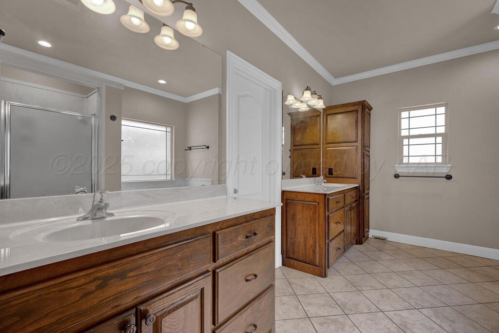 6607 Sumac Place Amarillo, TX 79124 - Photo 14 of 33 a bathroom with a sink double vanity and a mirror
