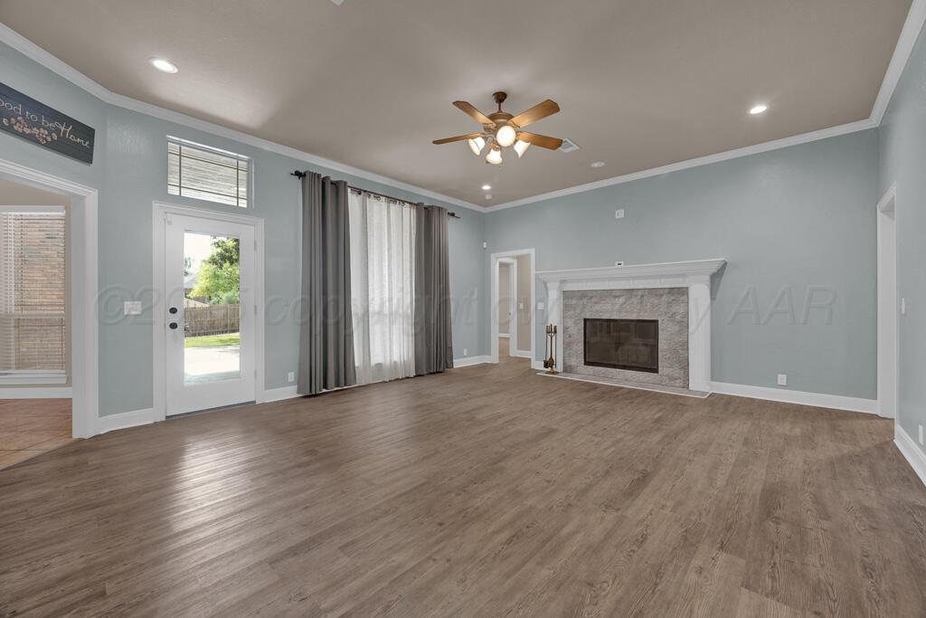 6607 Sumac Place Amarillo, TX 79124 - Photo 2 of 33 a view of an empty room with wooden floor and a window