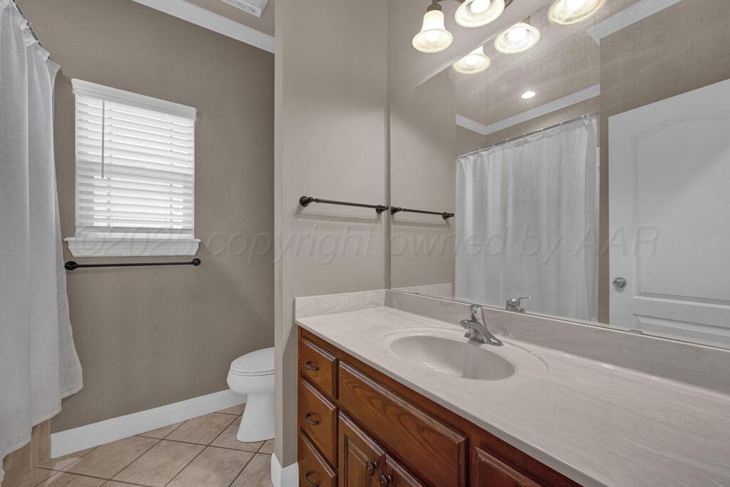 6607 Sumac Place Amarillo, TX 79124 - Photo 26 of 33 a bathroom with a sink toilet double vanity and tub