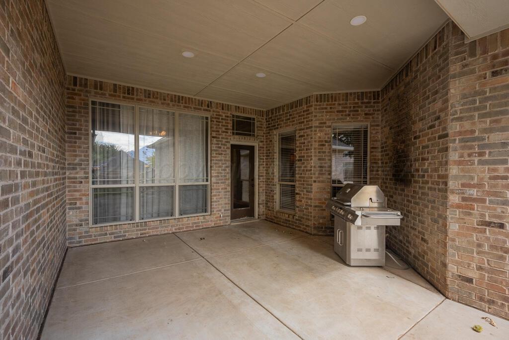 6607 Sumac Place Amarillo, TX 79124 - Photo 30 of 33 a view of an empty room with a glass door and chair