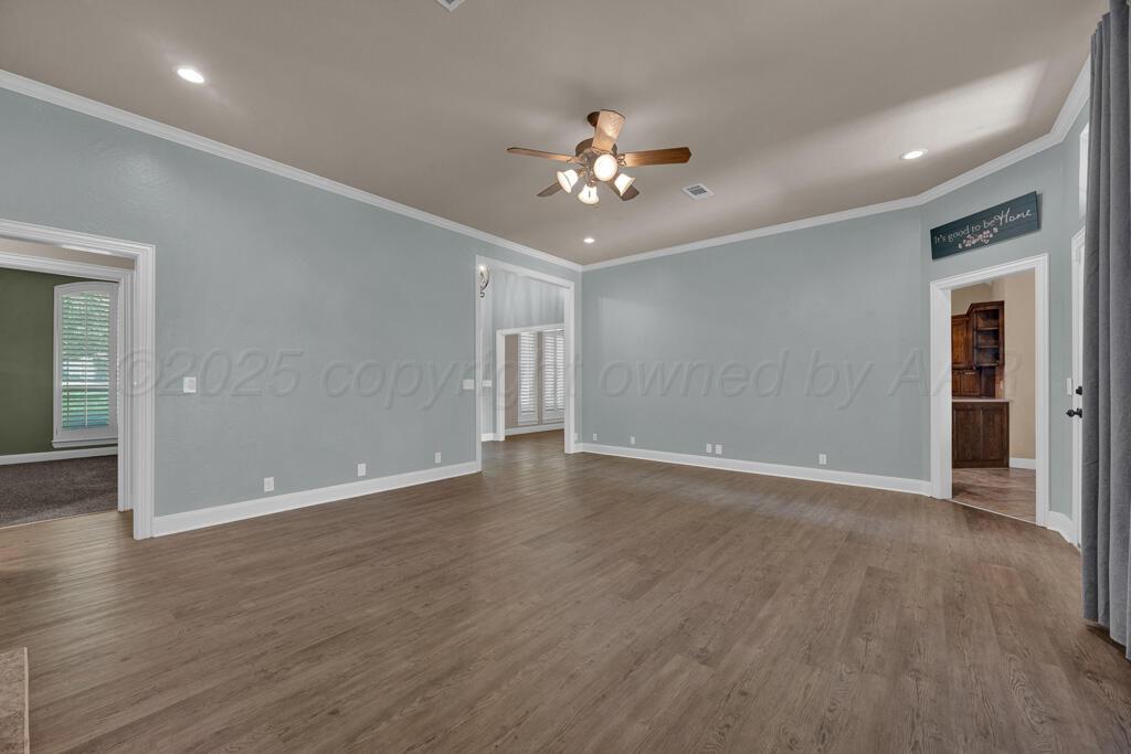 6607 Sumac Place Amarillo, TX 79124 - Photo 4 of 33 a view of an empty room with wooden floor