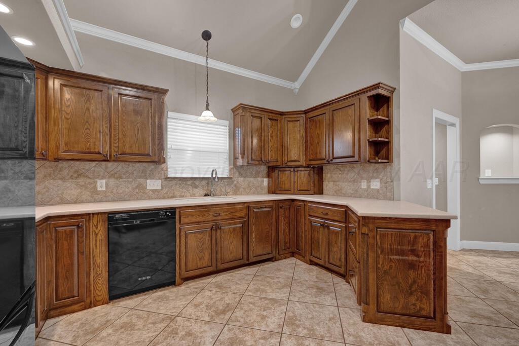 6607 Sumac Place Amarillo, TX 79124 - Photo 7 of 33 a kitchen with stainless steel appliances granite countertop a sink and cabinets