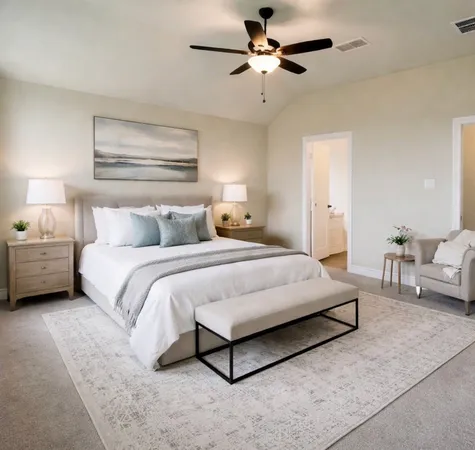 a large kitchen with stainless steel appliances lots of white cabinets and a couch