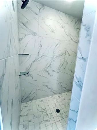 a bathroom with a sink double vanity and a mirror