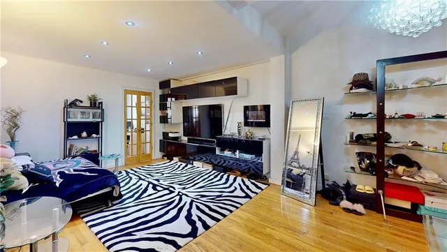 a living room with furniture or couch and a flat screen tv