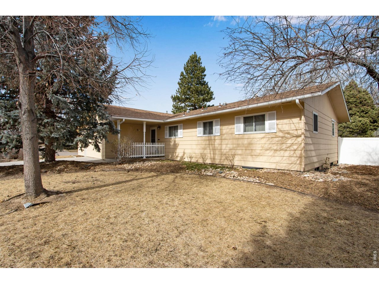 300 Ruth Street Fort Collins, CO 80525 - Photo 1 of 37 a view of a house with a yard