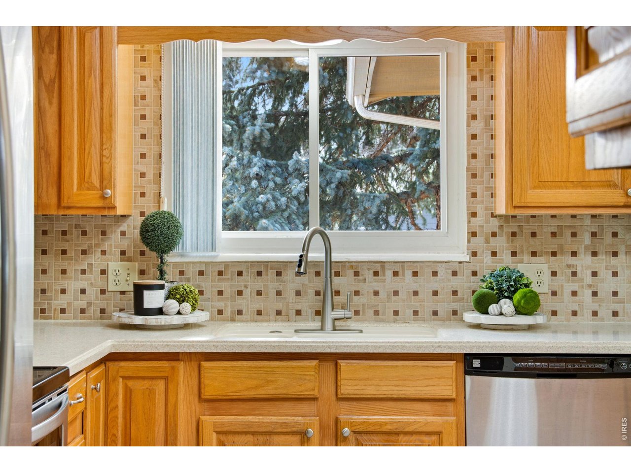 300 Ruth Street Fort Collins, CO 80525 - Photo 19 of 37 a view of a kitchen with granite countertop a sink and a window