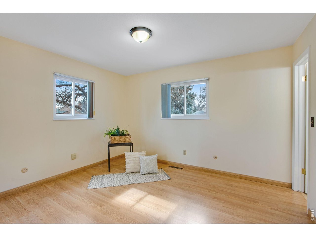 300 Ruth Street Fort Collins, CO 80525 - Photo 20 of 37 a view of empty room with wooden floor