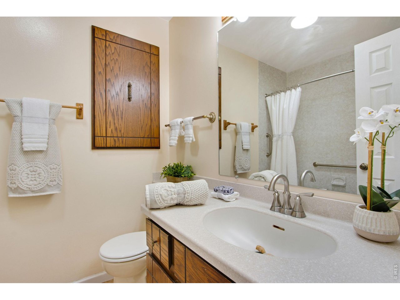 300 Ruth Street Fort Collins, CO 80525 - Photo 24 of 37 a bathroom with a sink and a mirror