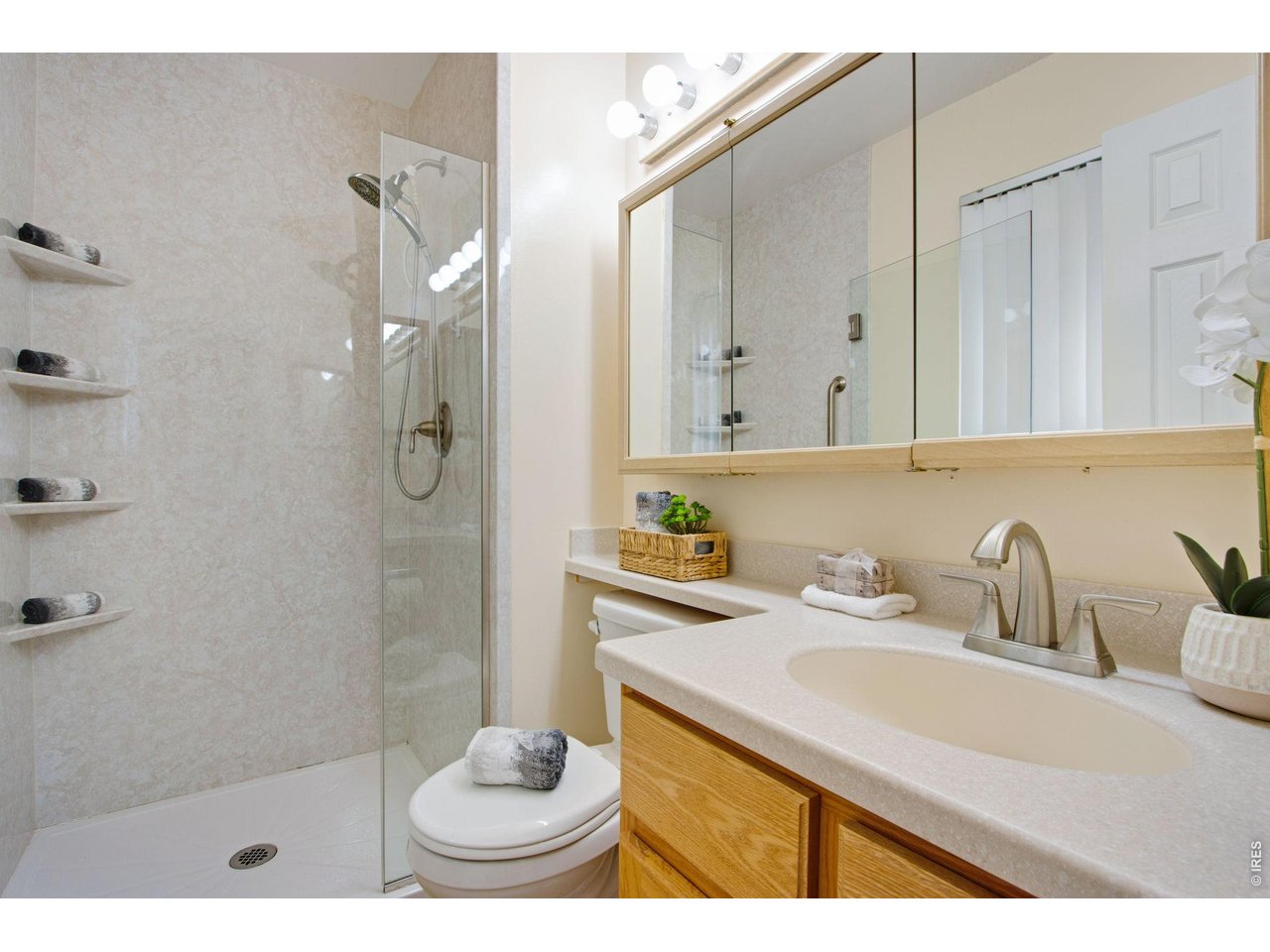 300 Ruth Street Fort Collins, CO 80525 - Photo 25 of 37 a bathroom with a sink a toilet and shower