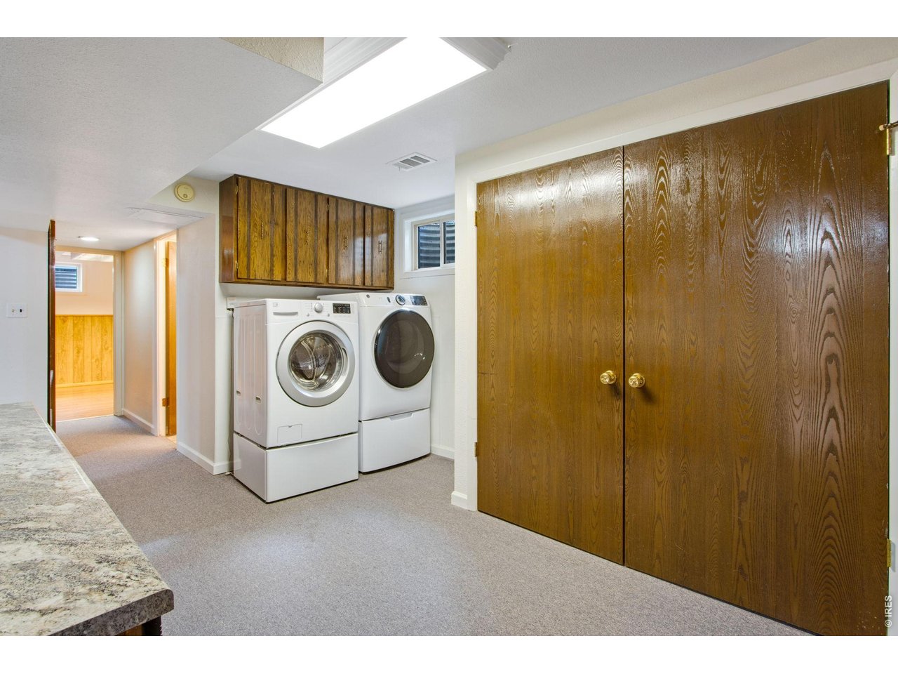 300 Ruth Street Fort Collins, CO 80525 - Photo 33 of 37 a utility room with dryer and washer