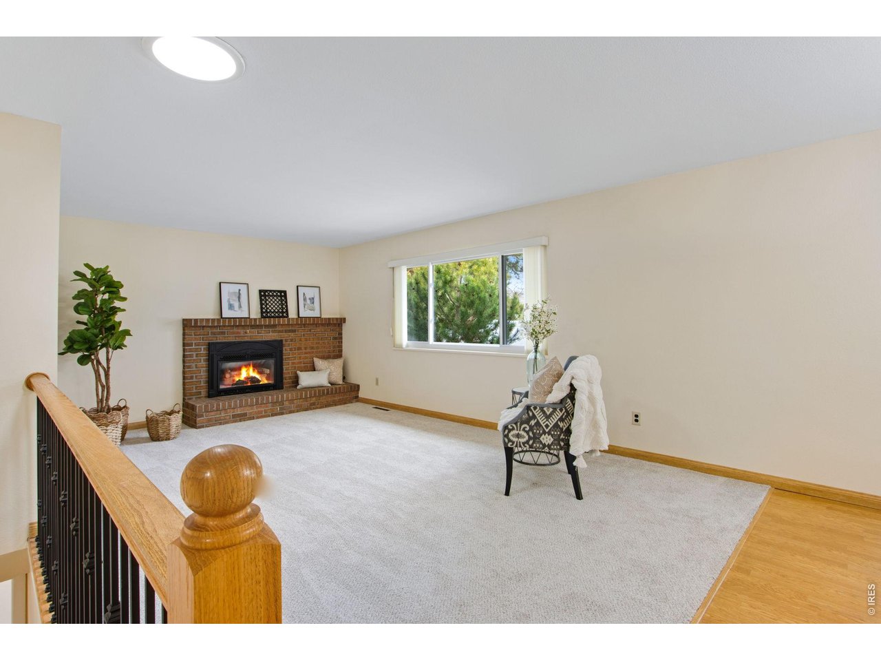 300 Ruth Street Fort Collins, CO 80525 - Photo 7 of 37 a living room with furniture and a fireplace