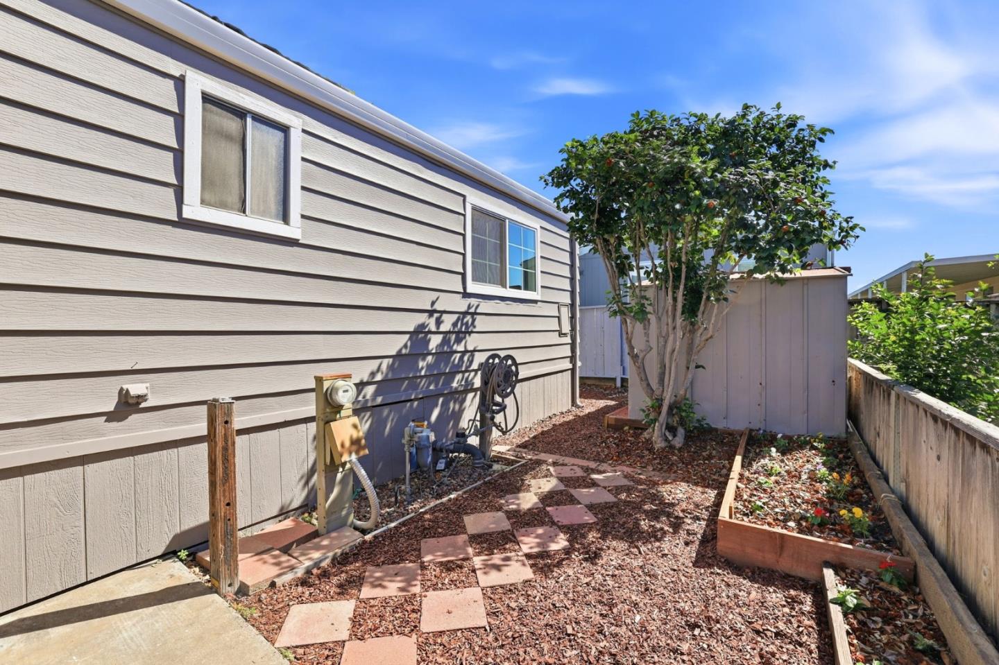 555 Umbarger Road, Unit 31 San Jose, CA 95111 - Photo 16 of 18 a view of a house with a yard