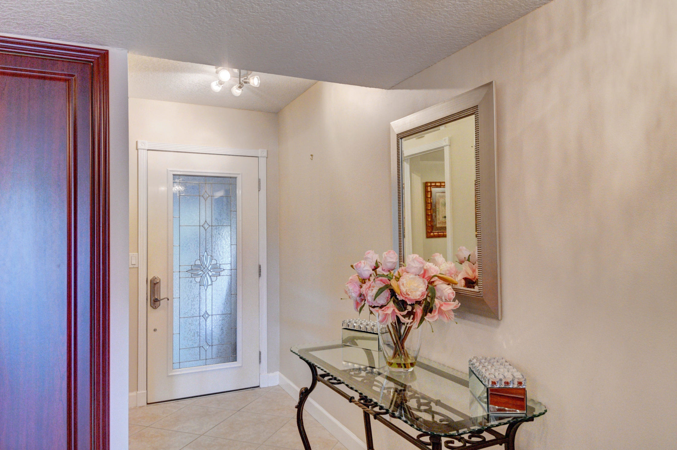210 Captains Walk, Unit 710 Delray Beach, FL 33483 - Photo 2 of 49 a dining room with furniture and wooden floor