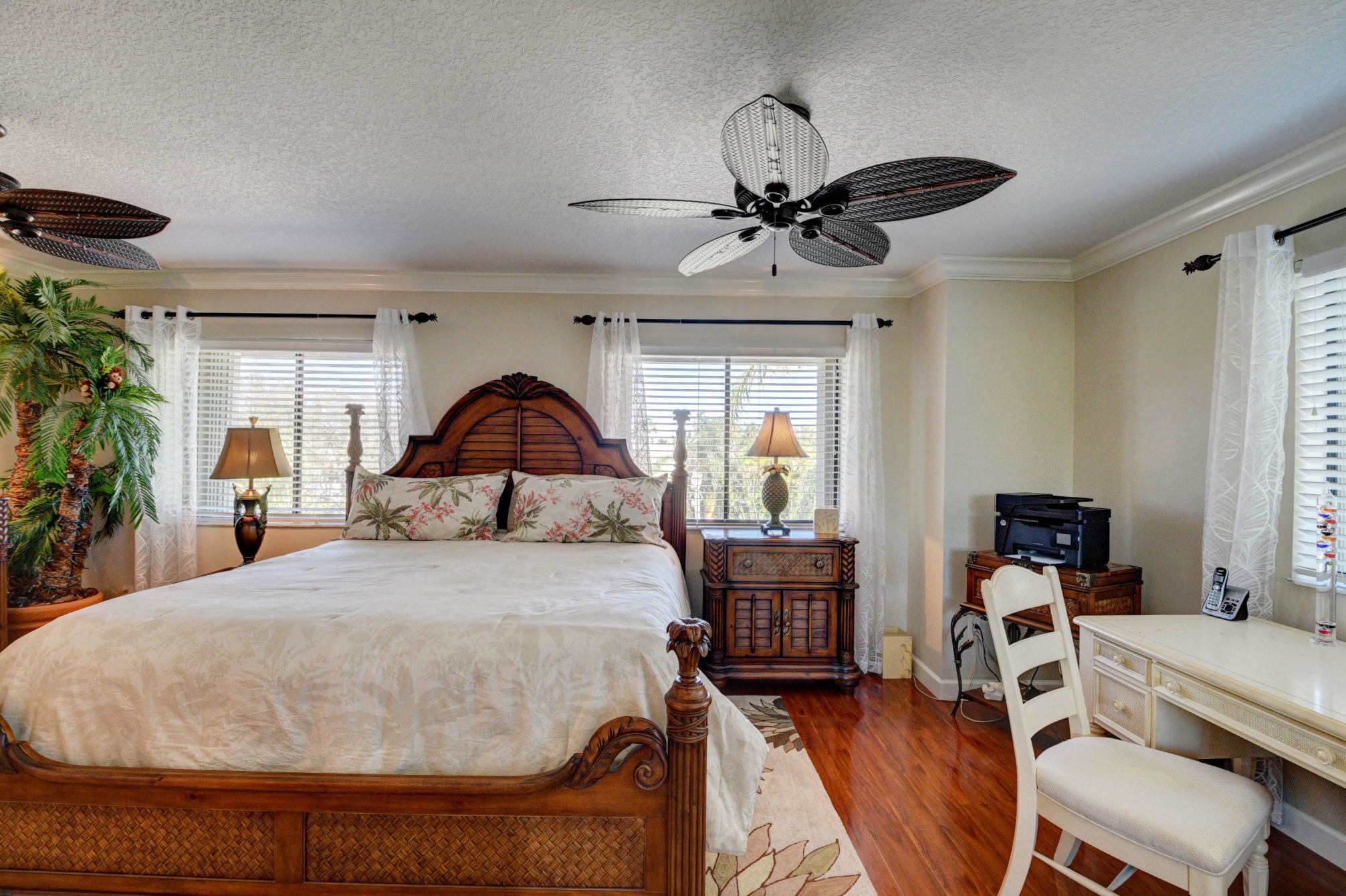 210 Captains Walk, Unit 710 Delray Beach, FL 33483 - Photo 15 of 49 a bed room with a bed and a chair
