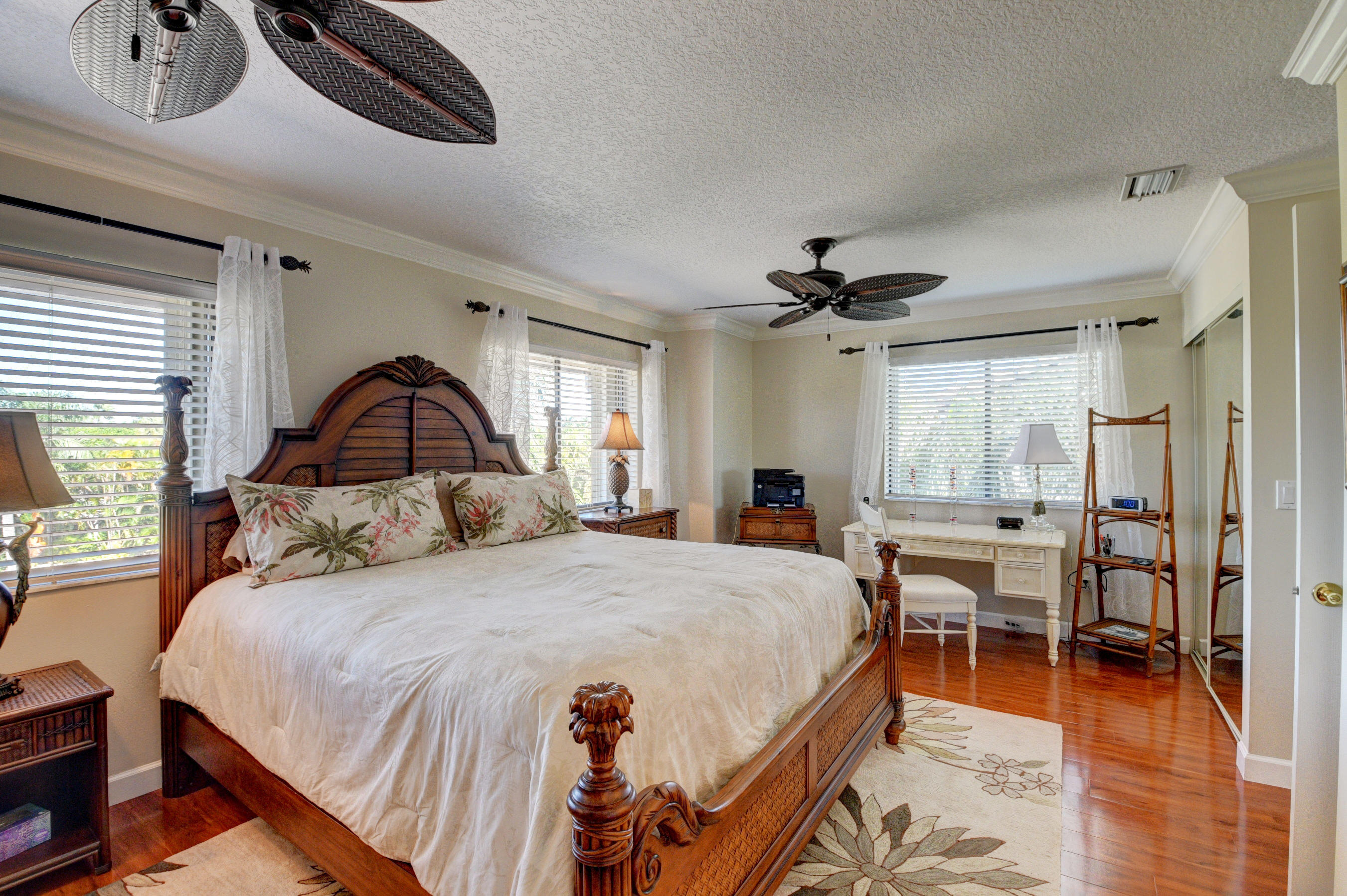 210 Captains Walk, Unit 710 Delray Beach, FL 33483 - Photo 17 of 49 a bedroom with a bed and a large window
