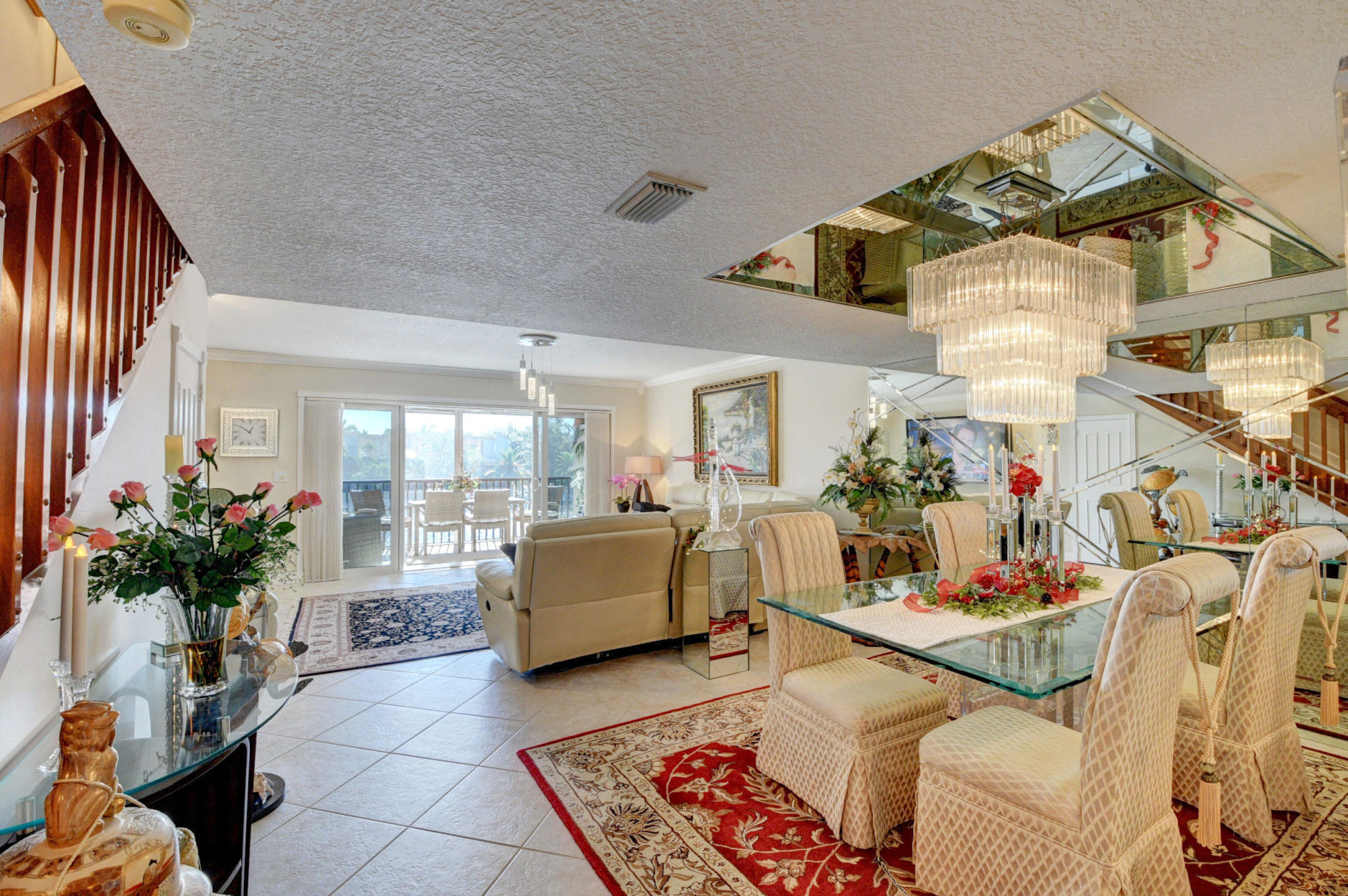 210 Captains Walk, Unit 710 Delray Beach, FL 33483 - Photo 3 of 49 a living room with furniture and a chandelier
