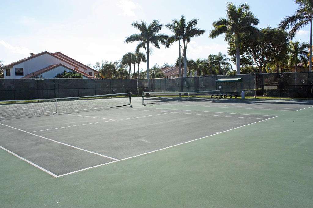 210 Captains Walk, Unit 710 Delray Beach, FL 33483 - Photo 40 of 49 a view of tennis court