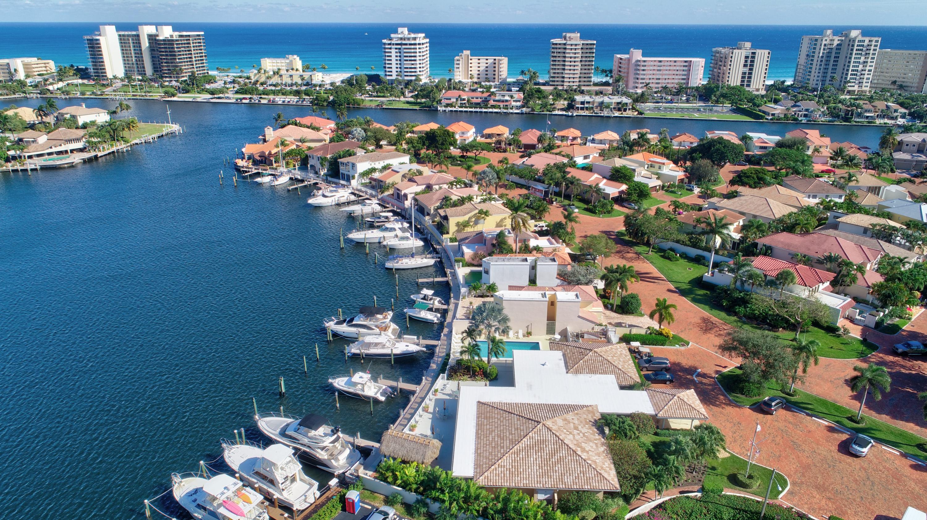 210 Captains Walk, Unit 710 Delray Beach, FL 33483 - Photo 43 of 49 an aerial view of a city with lots of residential buildings ocean and mountain view in back